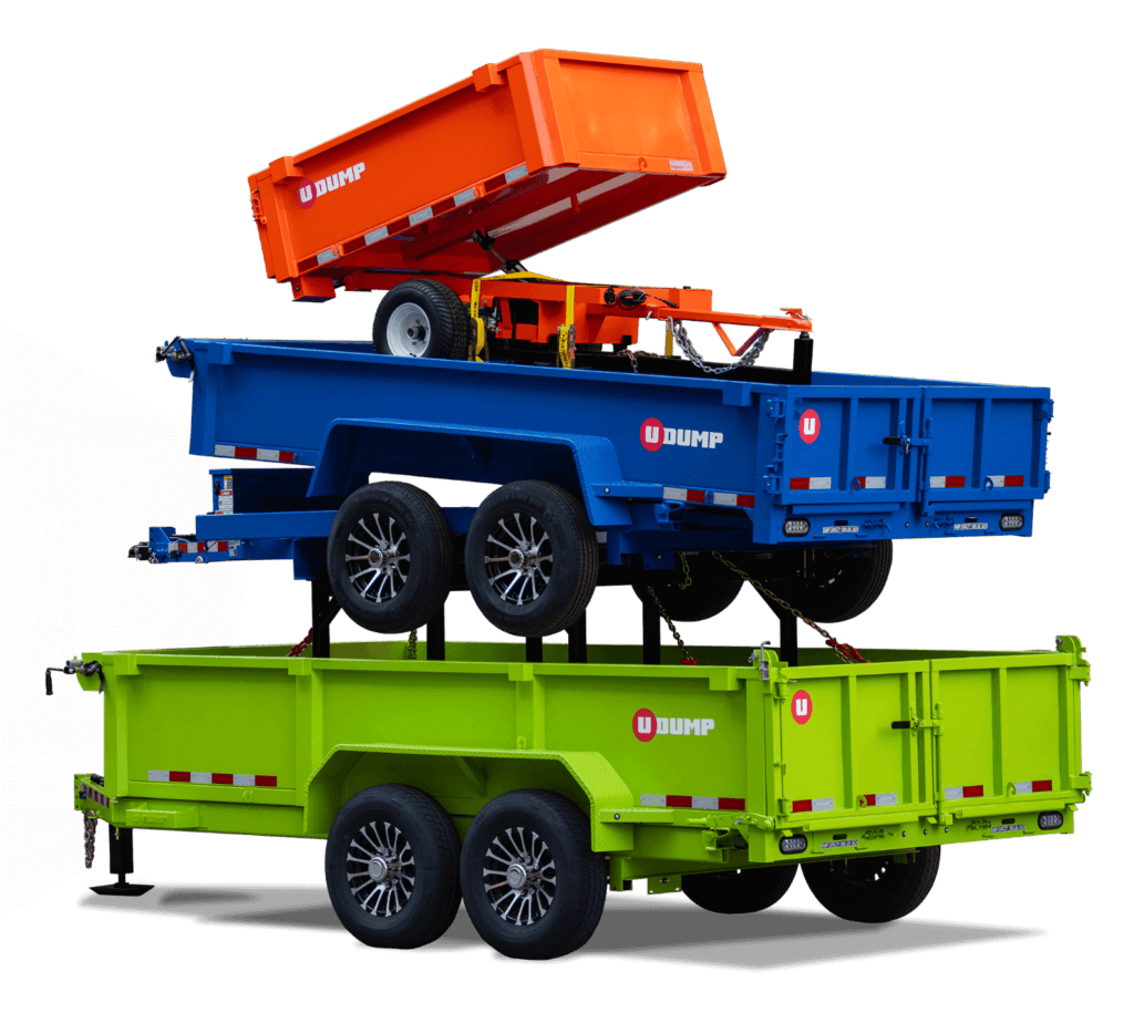 A stack of three colorful dump trailers: orange on top, blue in the middle, and green at the bottom, each with dual wheels and labeled "U Dump.