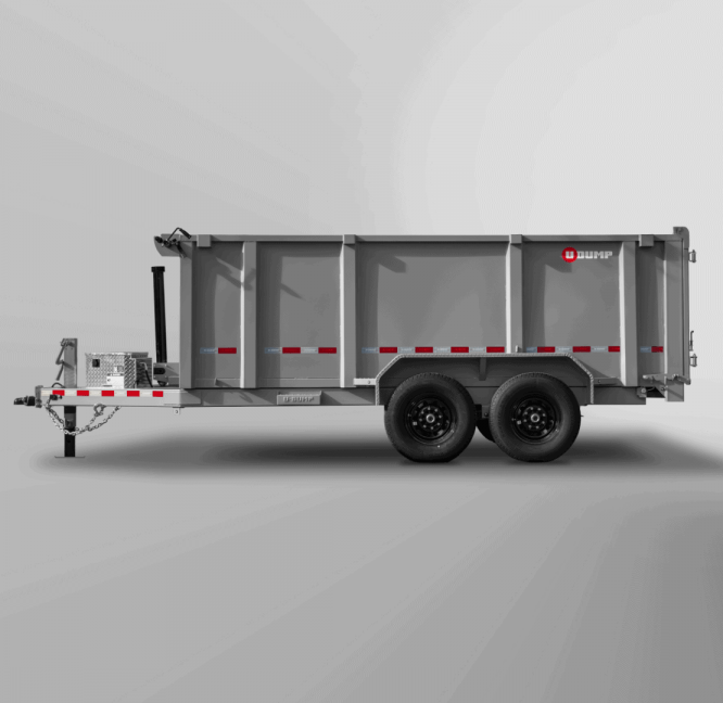 The Pro-Heavy Low-Profile Dump Trailer features dual axles, a hydraulic lift, and gray color with red and white reflective stripes along the sides against a plain background.